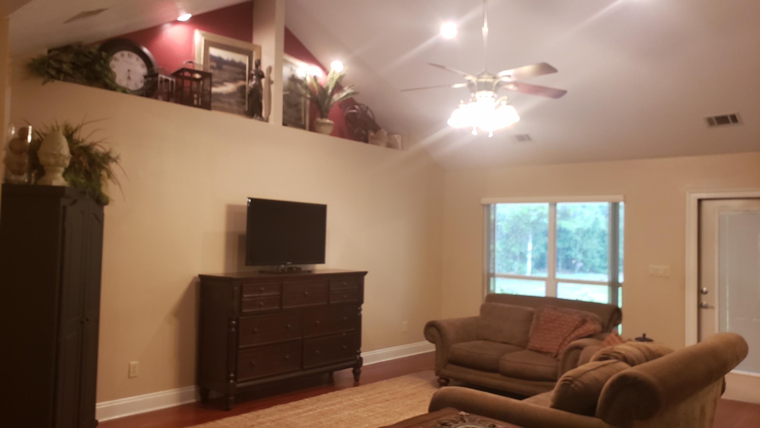 591 Ridge Lake Road Crestview, FL 32536 - Photo 16 of 31 a living room with furniture and a flat screen tv