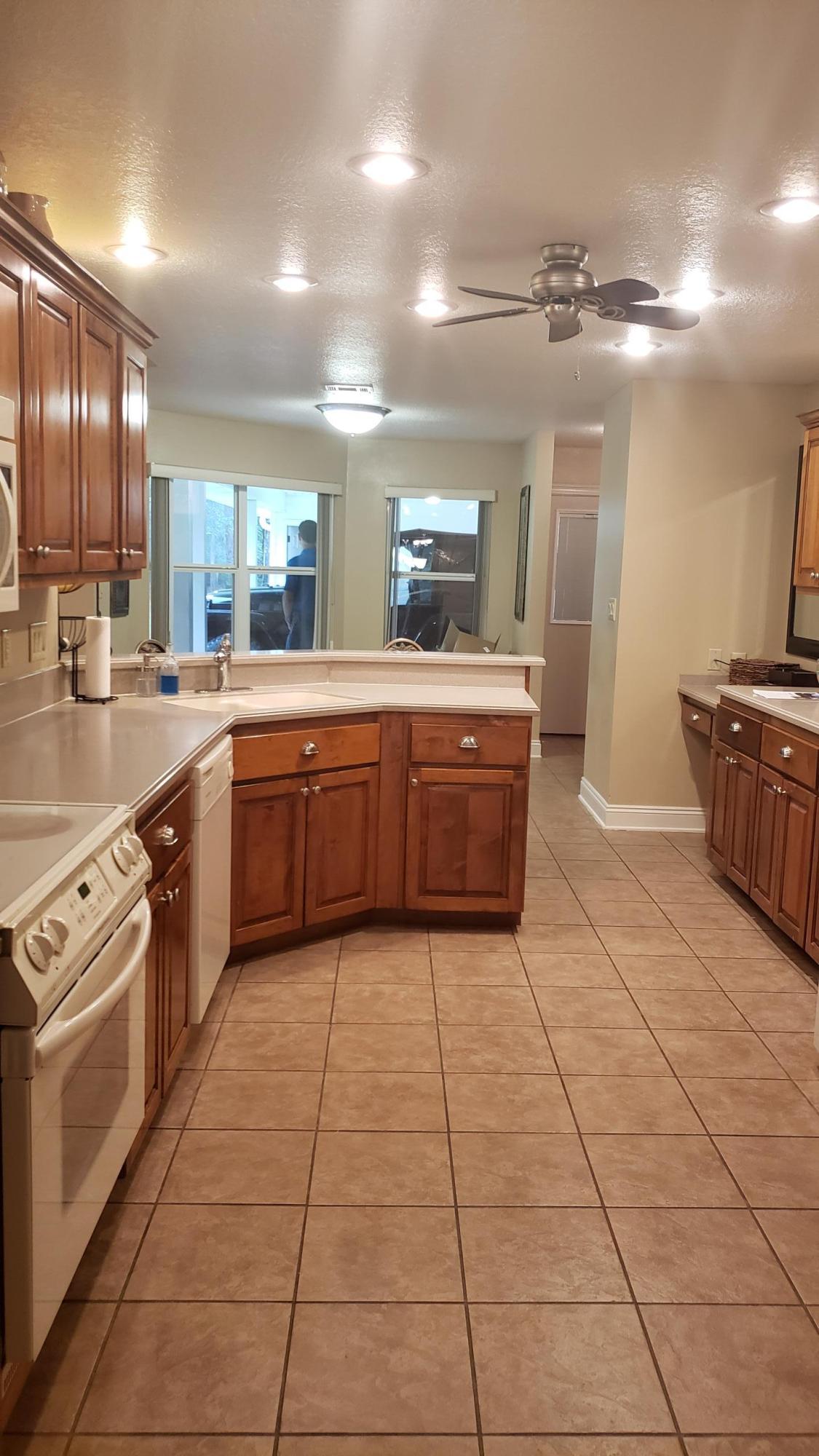 591 Ridge Lake Road Crestview, FL 32536 - Photo 17 of 31 a large kitchen with cabinets and wooden floor