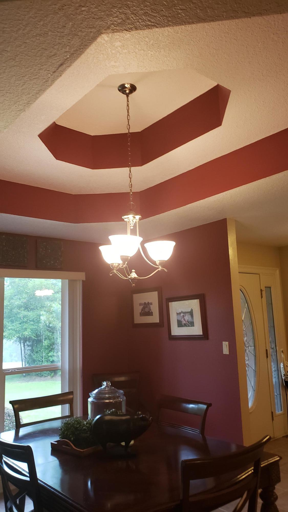 591 Ridge Lake Road Crestview, FL 32536 - Photo 19 of 31 a room with furniture and a chandelier