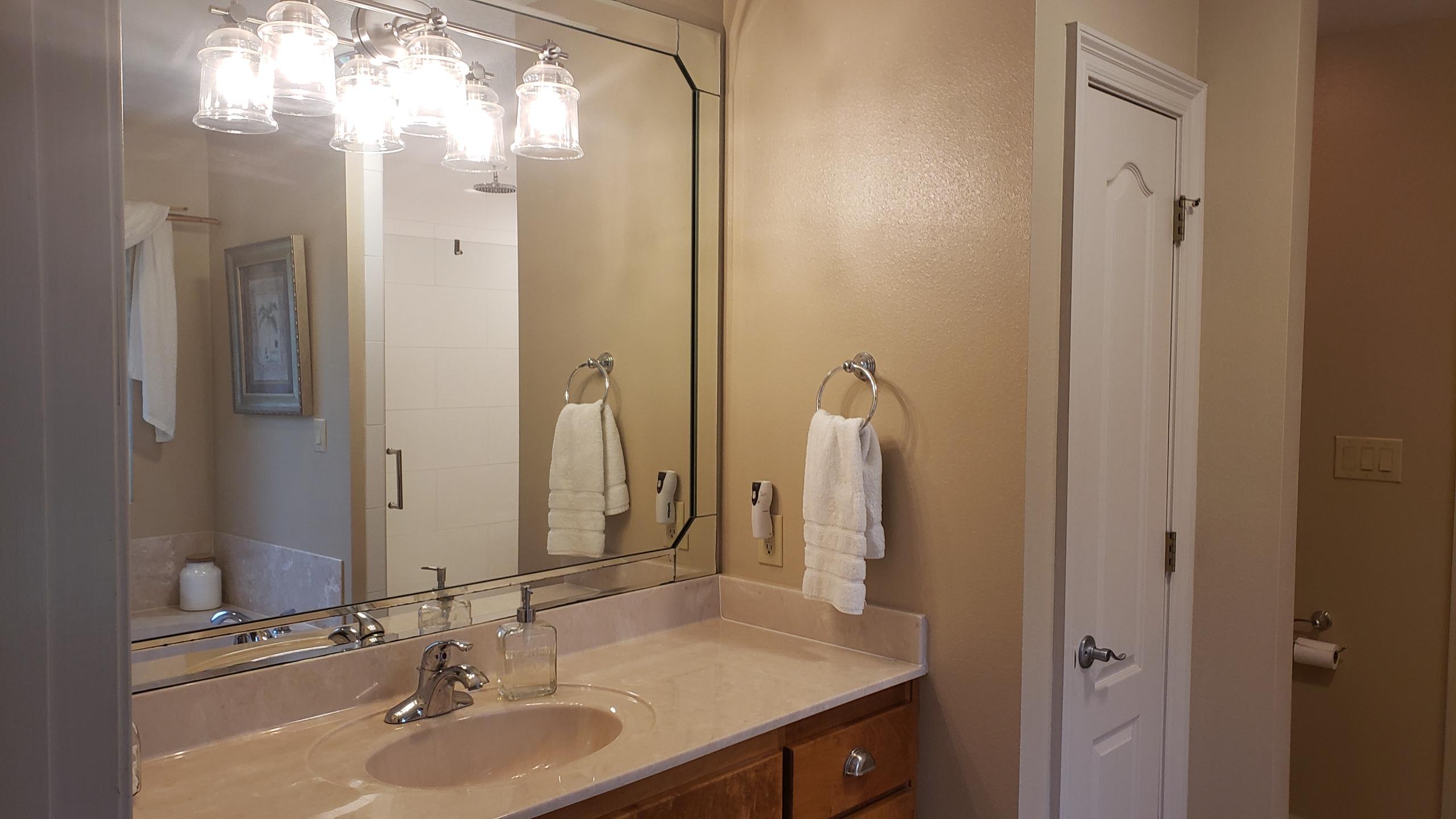 591 Ridge Lake Road Crestview, FL 32536 - Photo 22 of 31 a bathroom with a sink double vanity and a mirror