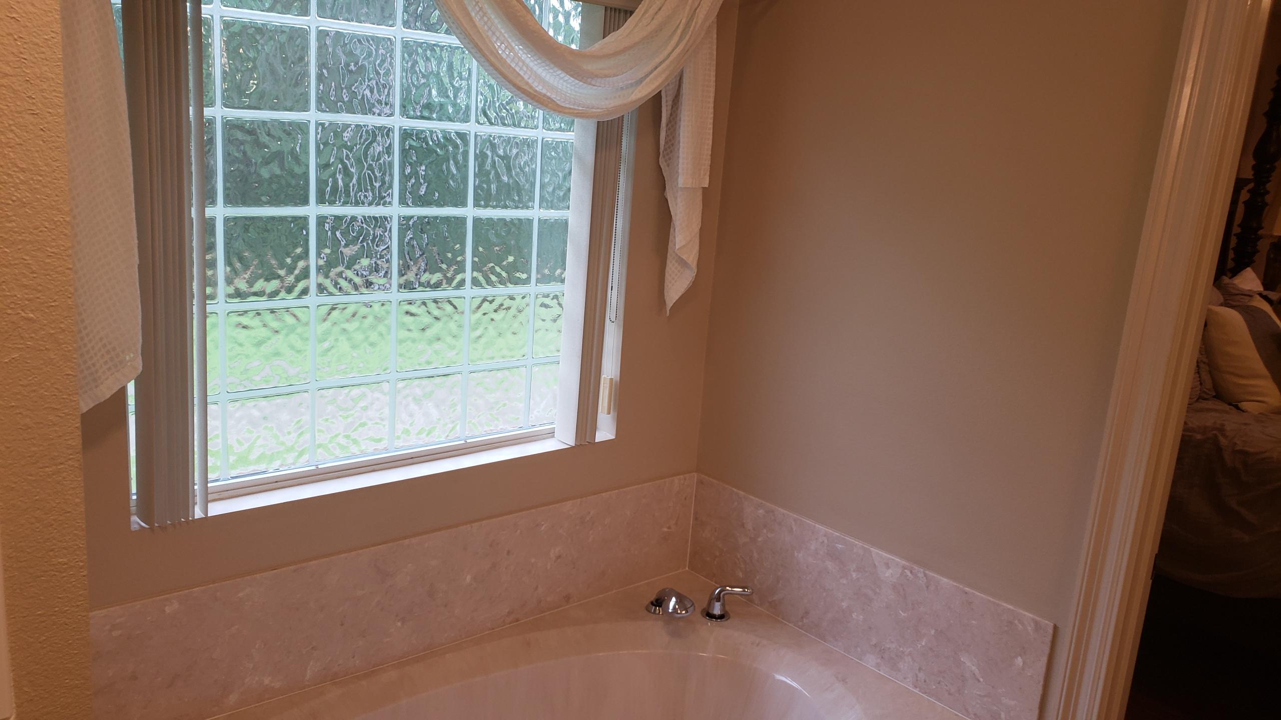 591 Ridge Lake Road Crestview, FL 32536 - Photo 24 of 31 a bathroom with a window and a shower