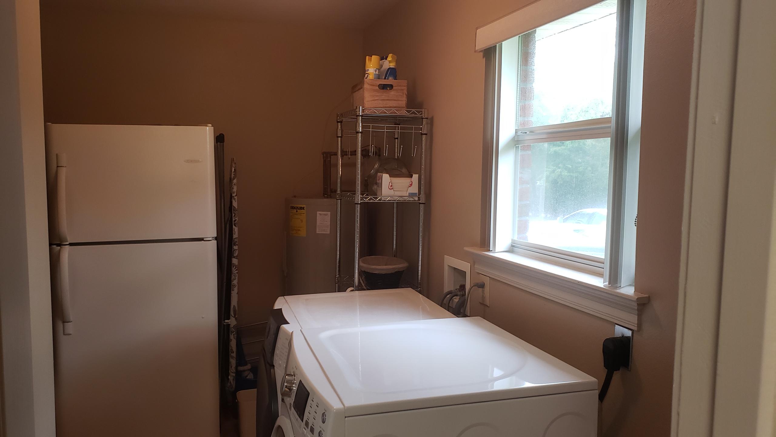 591 Ridge Lake Road Crestview, FL 32536 - Photo 28 of 31 a kitchen with a refrigerator and window