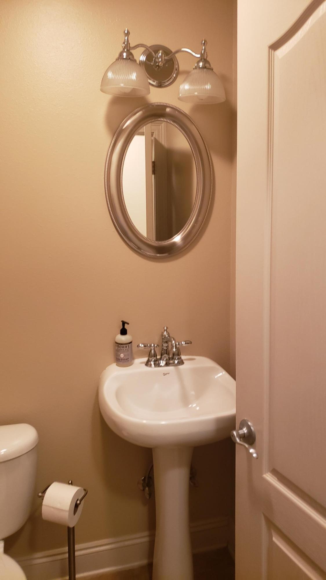 591 Ridge Lake Road Crestview, FL 32536 - Photo 30 of 31 a bathroom with a sink and a mirror