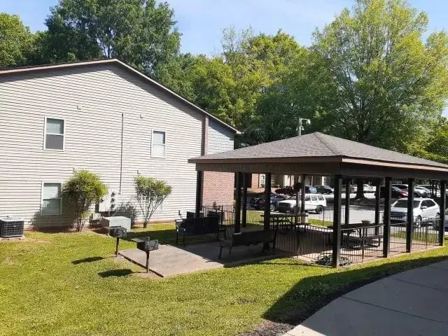 a backyard of a house with seating space