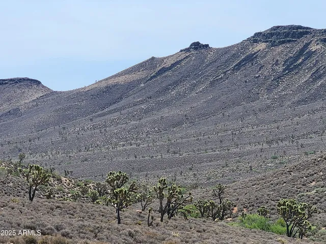 a view of mountains and valleys