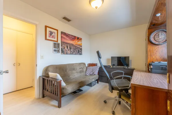 a view of living room kitchen and entryway
