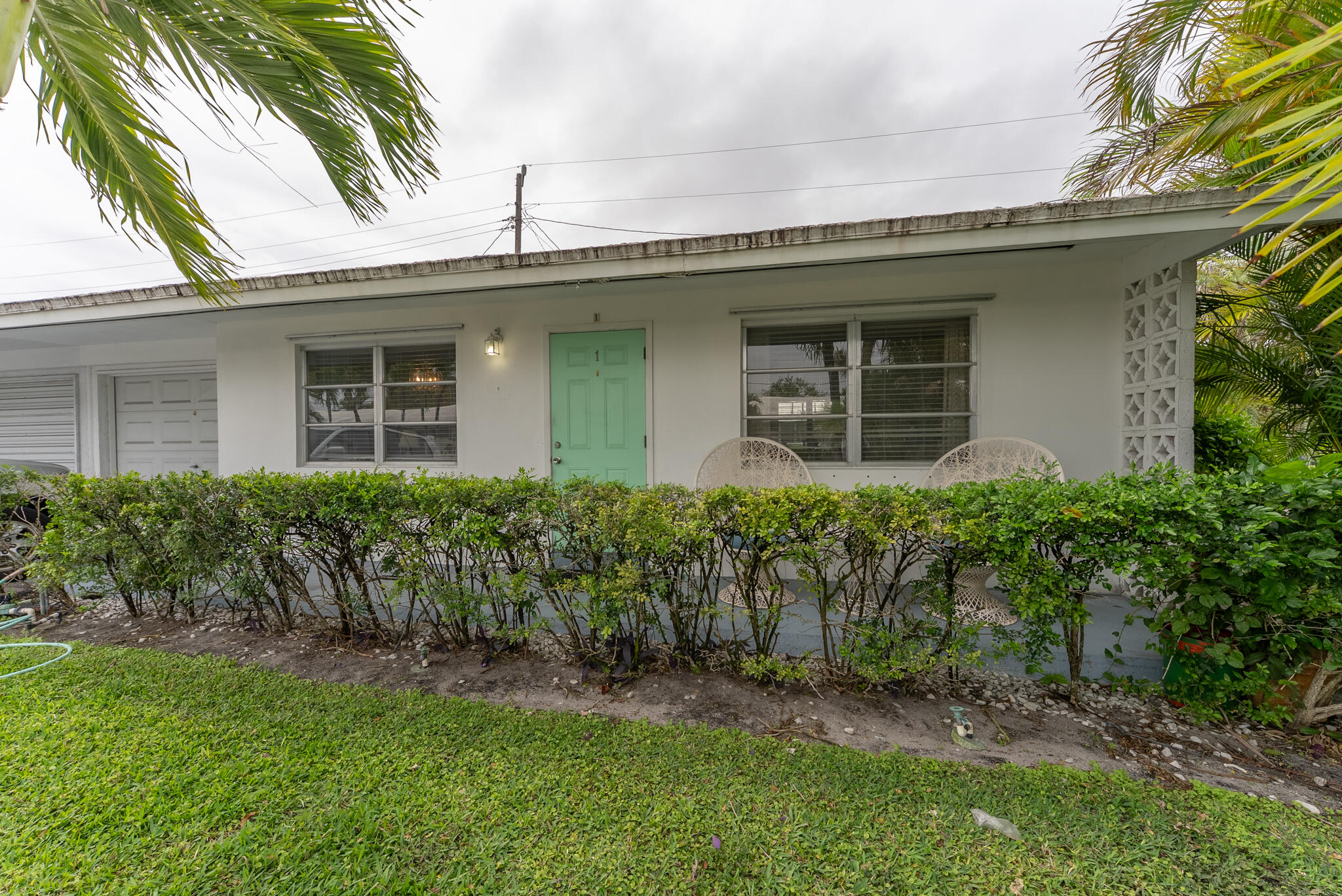 722 Ridge Road, Unit 1 Lantana, FL 33462 - Photo 3 of 20 a front view of a house with garden