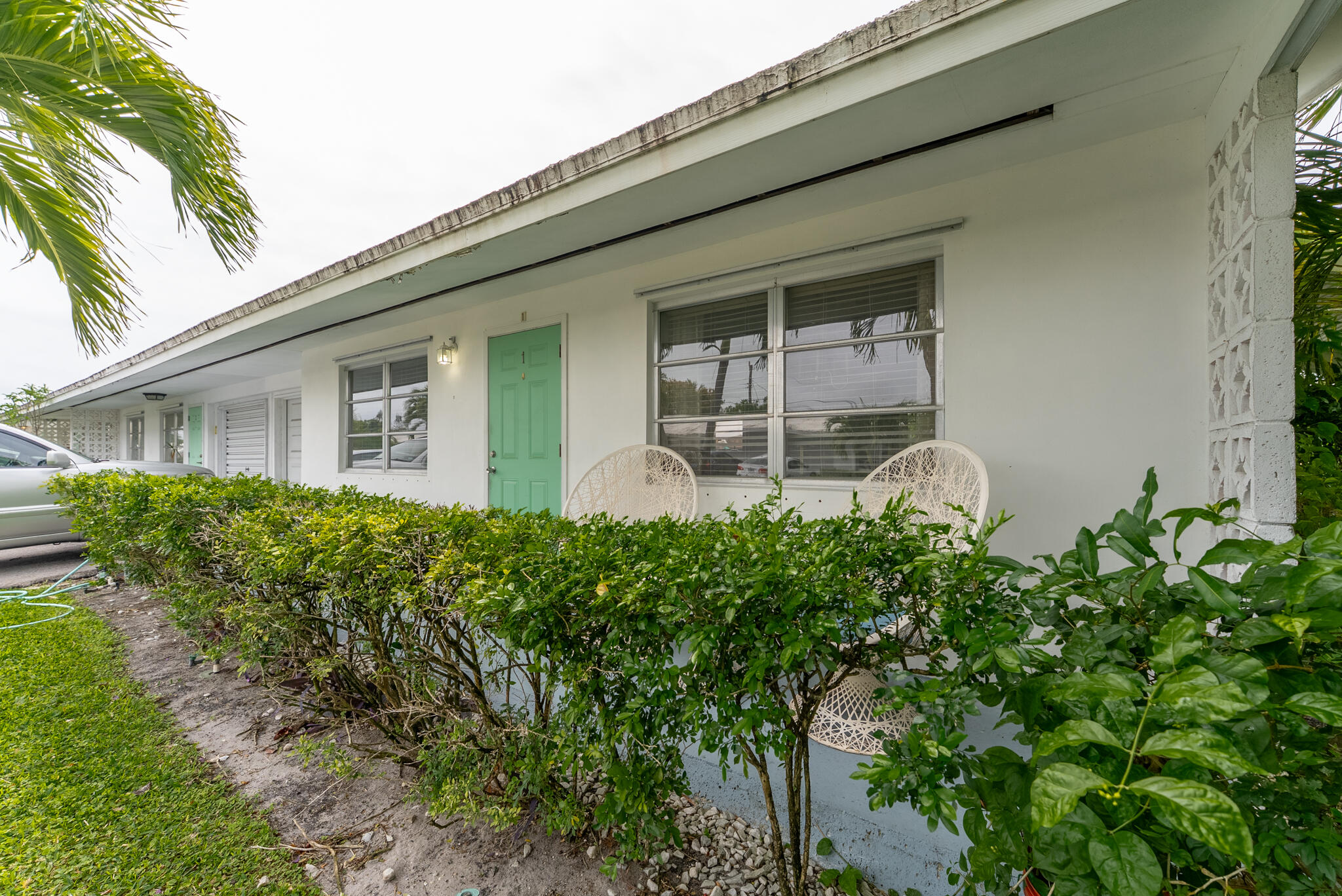 722 Ridge Road, Unit 1 Lantana, FL 33462 - Photo 4 of 20 a front view of a house with garden