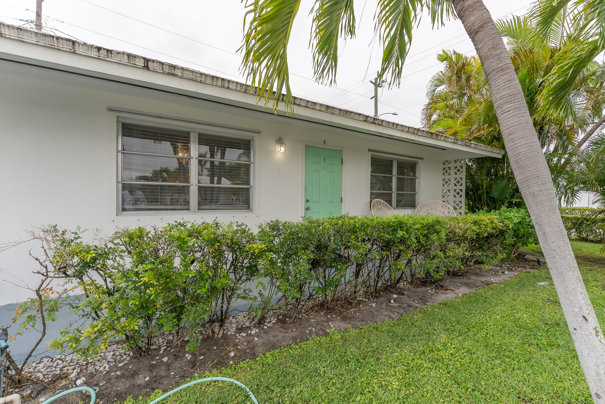 722 Ridge Road, Unit 1 Lantana, FL 33462 - Photo 5 of 20 front view of a house with a garden