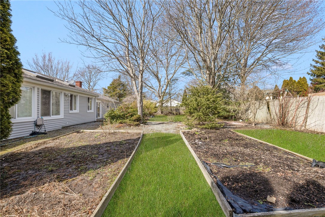 9 Spruce Avenue Middletown, RI 02842 - Photo 17 of 38 Flat yard with fencing.