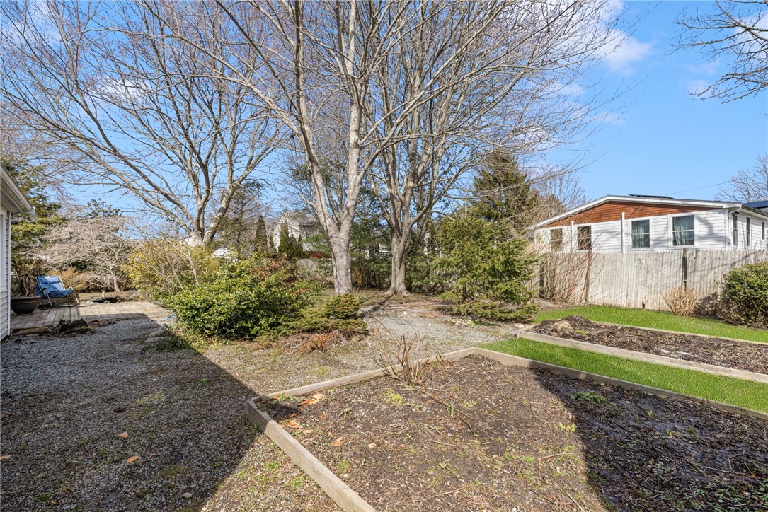 9 Spruce Avenue Middletown, RI 02842 - Photo 18 of 38 Garden beds and mature trees!