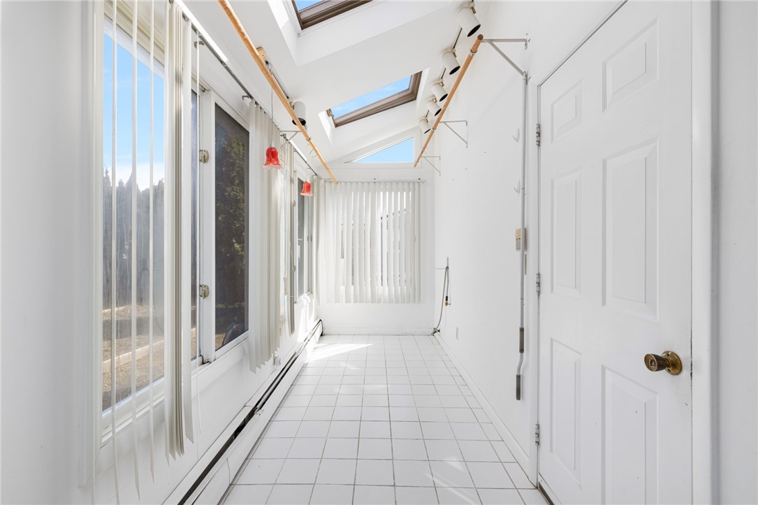 9 Spruce Avenue Middletown, RI 02842 - Photo 31 of 38 Off the family room, this doorway leads to the integral garage with opener! These skylights provide ample light for great hanging planters!