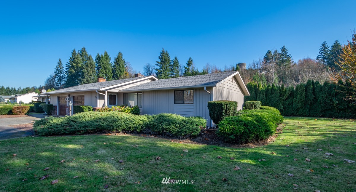 18630 Albany Street Southwest Rochester, WA 98579 - Photo 2 of 21 a view of a house with backyard and garden