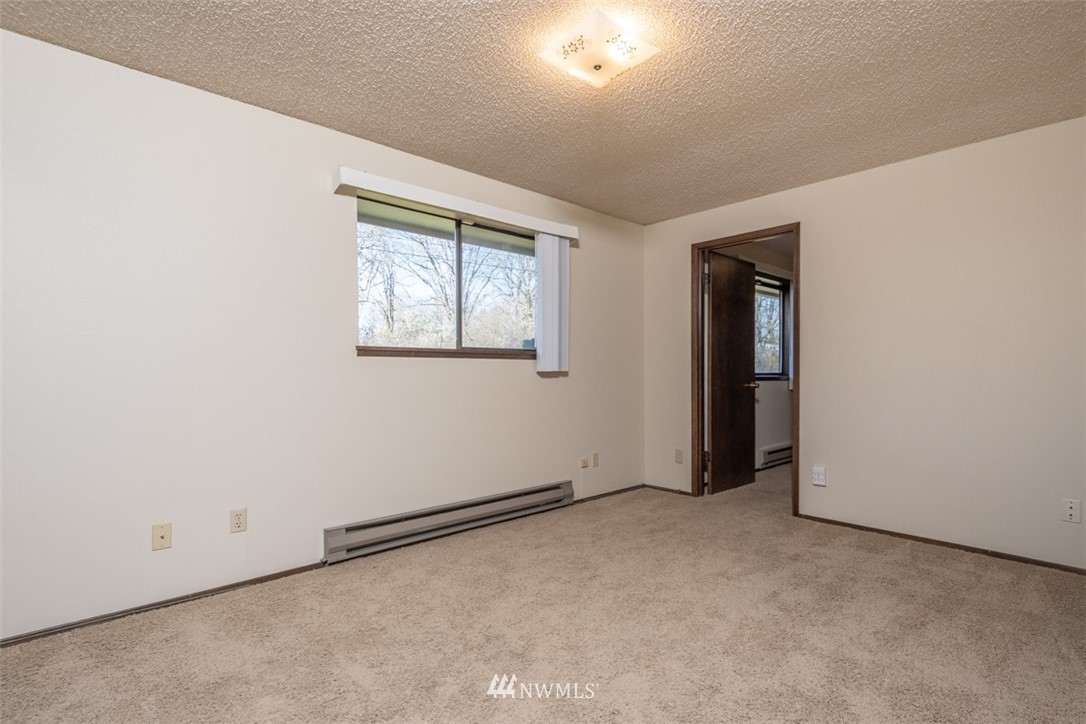 18630 Albany Street Southwest Rochester, WA 98579 - Photo 11 of 21 an empty room with windows