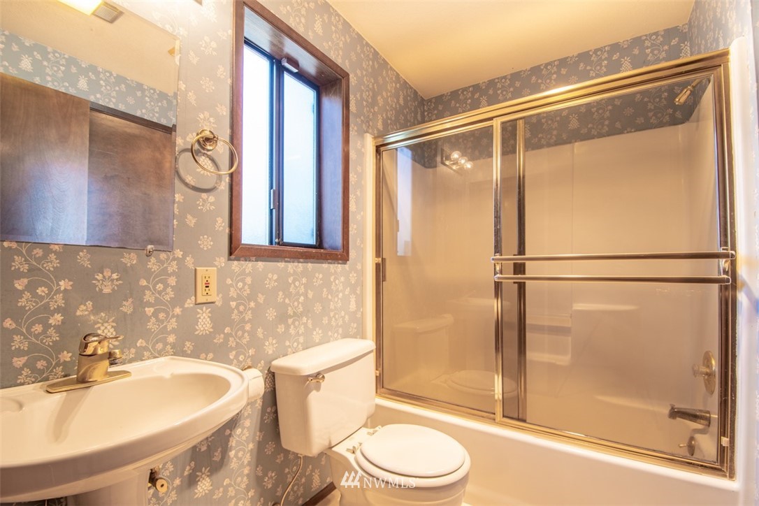 18630 Albany Street Southwest Rochester, WA 98579 - Photo 13 of 21 a bathroom with a sink toilet and shower