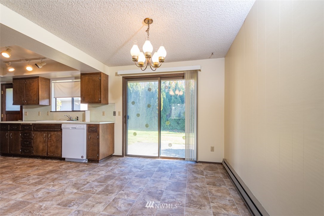 18630 Albany Street Southwest Rochester, WA 98579 - Photo 16 of 21 a view of a kitchen with a sink and a stove