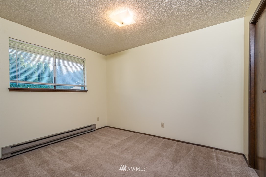 18630 Albany Street Southwest Rochester, WA 98579 - Photo 19 of 21 a view of empty room with wooden floor