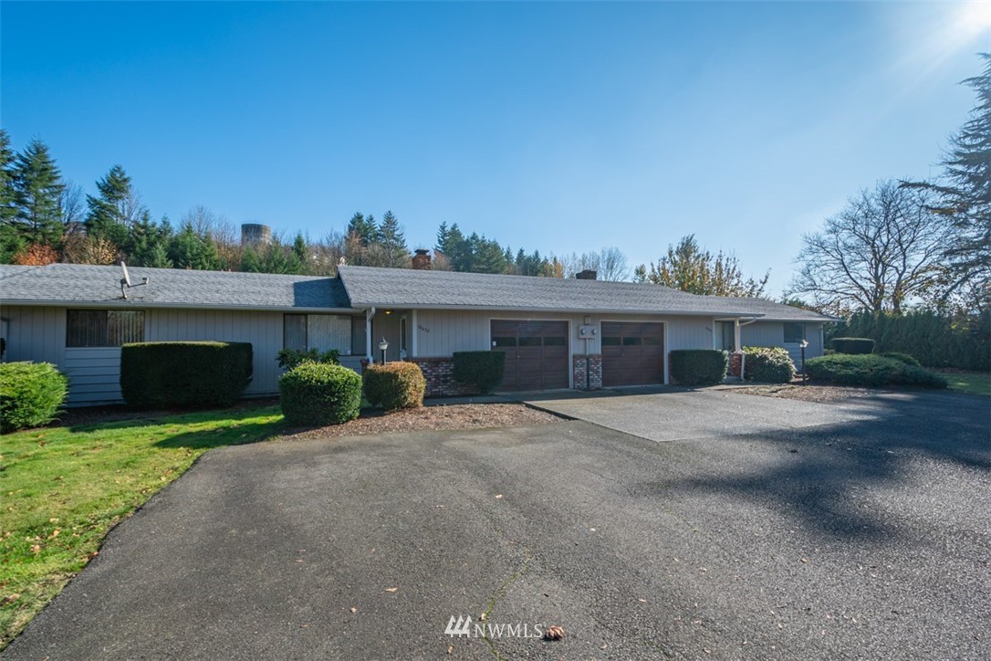 18630 Albany Street Southwest Rochester, WA 98579 - Photo 5 of 21 a view of a house with a yard and potted plants