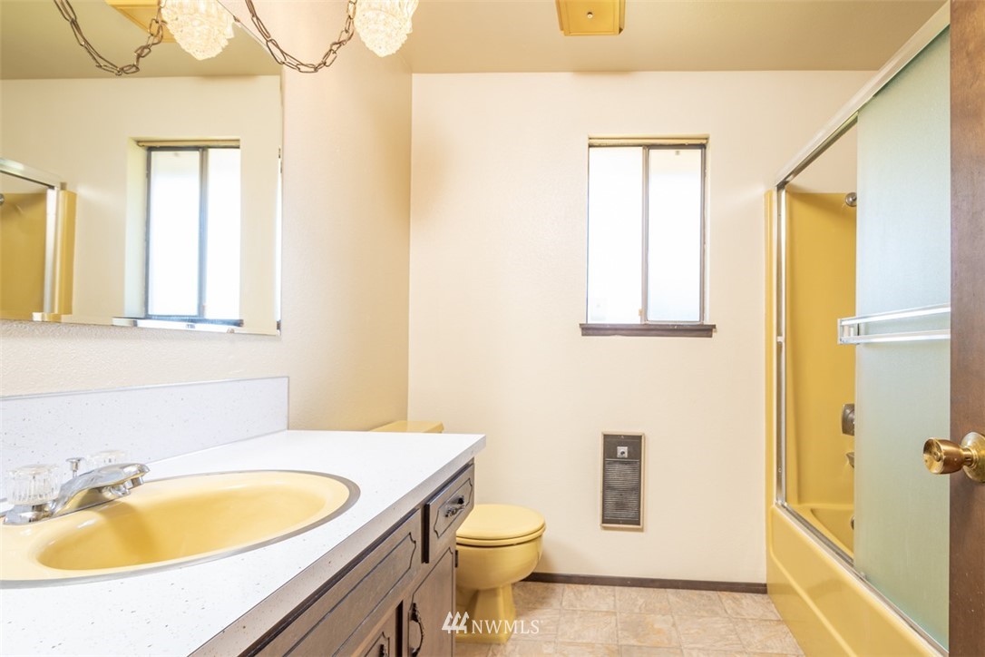 18630 Albany Street Southwest Rochester, WA 98579 - Photo 8 of 21 a bathroom with a sink a toilet and tub