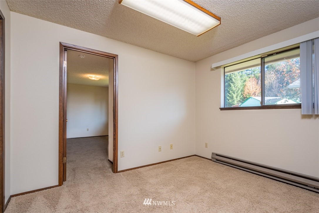18630 Albany Street Southwest Rochester, WA 98579 - Photo 9 of 21 an empty room with a window