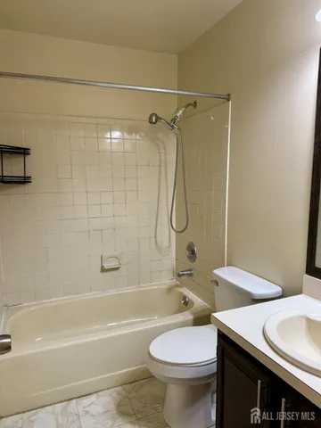 a bathroom with a sink a toilet and a bathtub