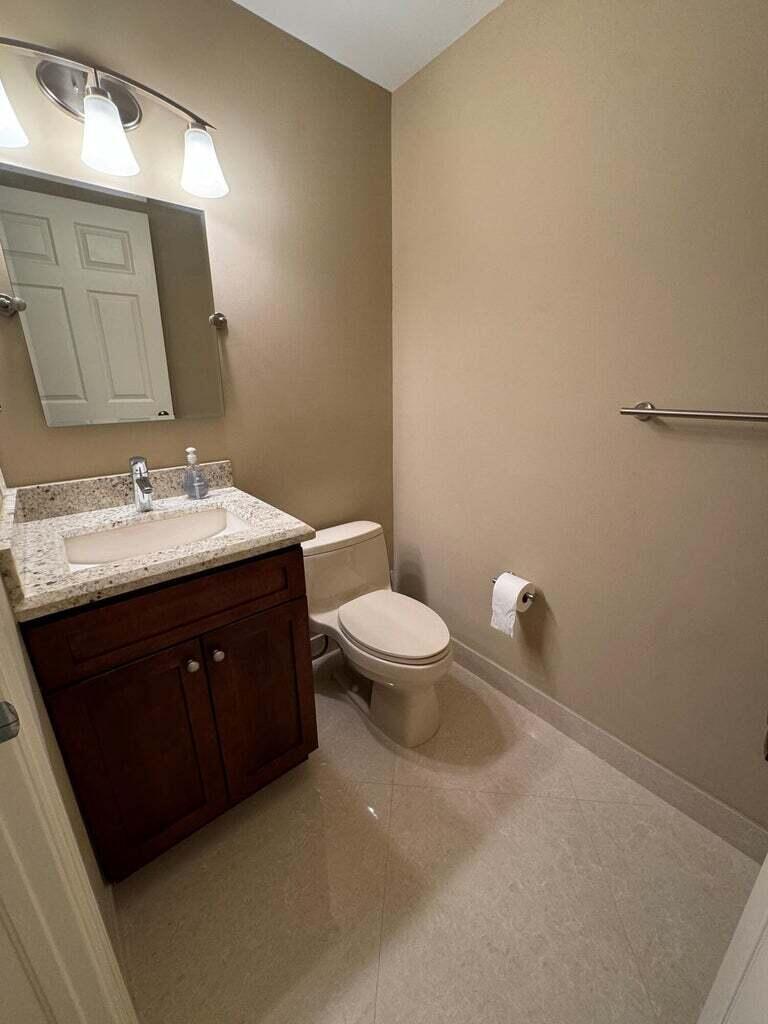17070 Boca Club Boulevard, Unit 6 Boca Raton, FL 33487 - Photo 8 of 23 Guest Half Bath Downstairs