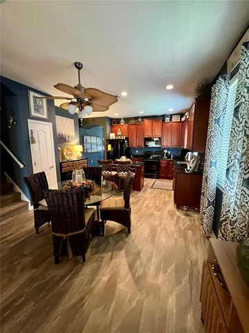 a living room with furniture a rug and a chandelier
