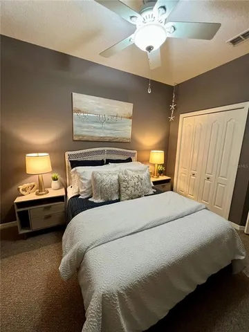 a living room with furniture a chandelier and a window
