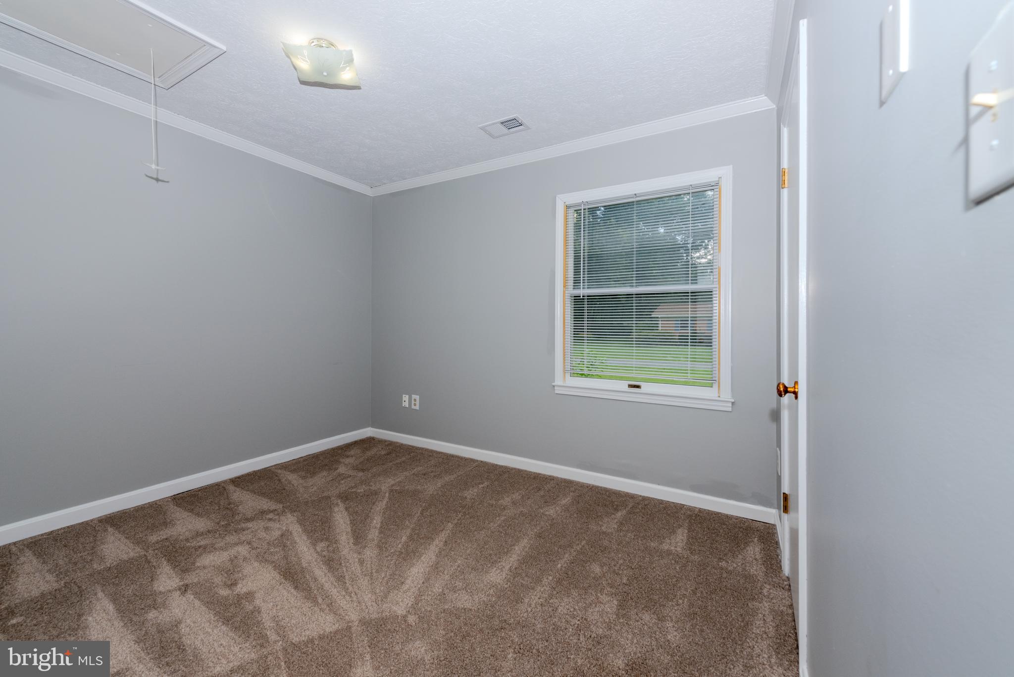 401 Kent Way Stevensville, MD 21666 - Photo 14 of 22 a view of an empty room with a window