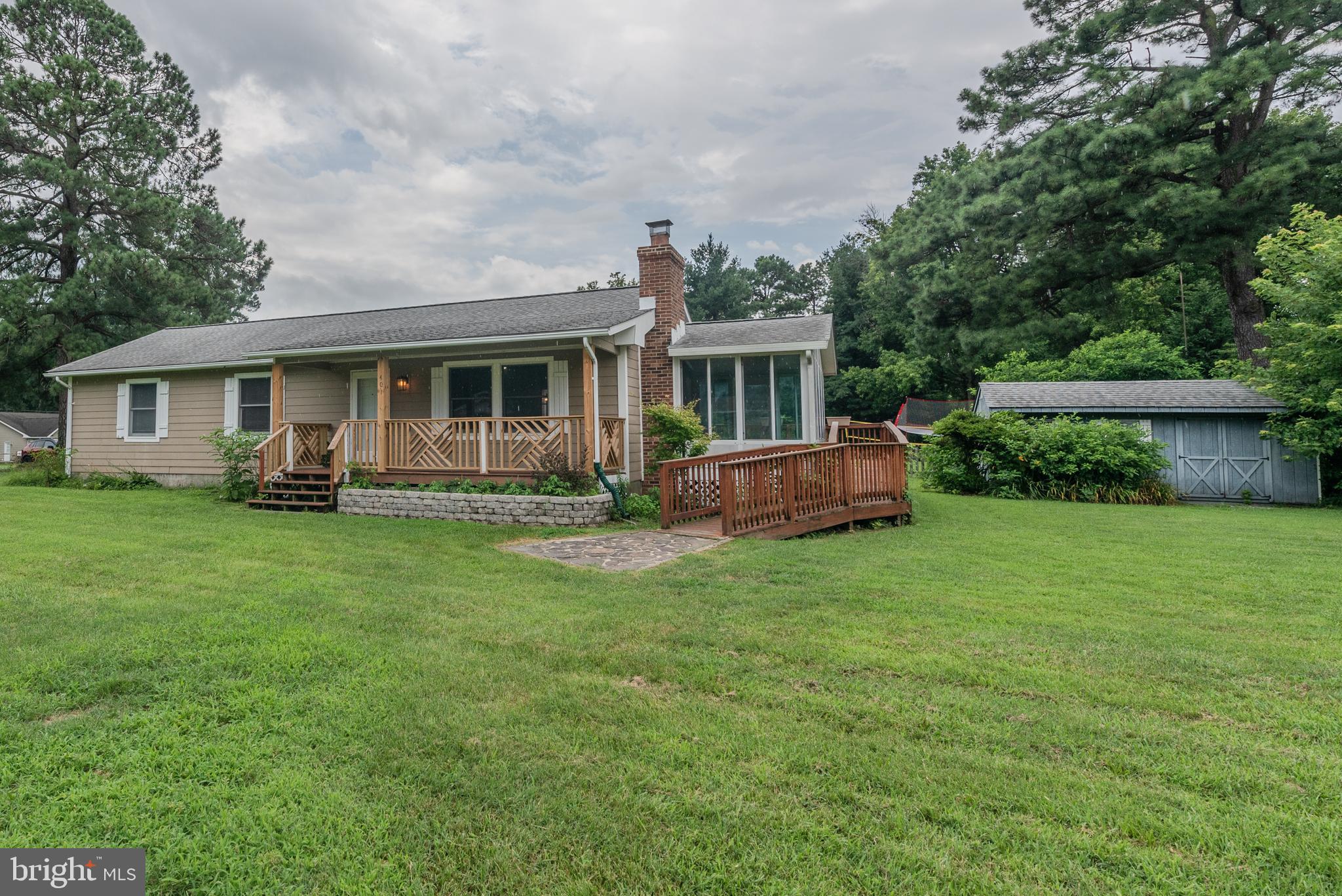 401 Kent Way Stevensville, MD 21666 - Photo 2 of 22 a front view of house with yard and green space