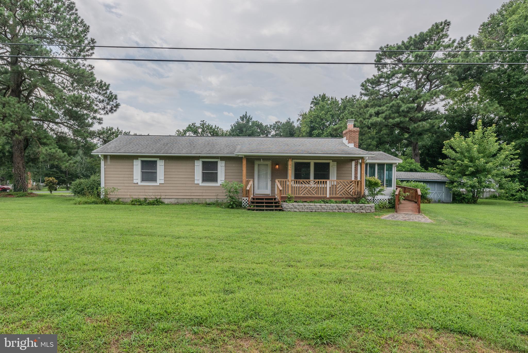 401 Kent Way Stevensville, MD 21666 - Photo 21 of 22 a front view of a house with a garden