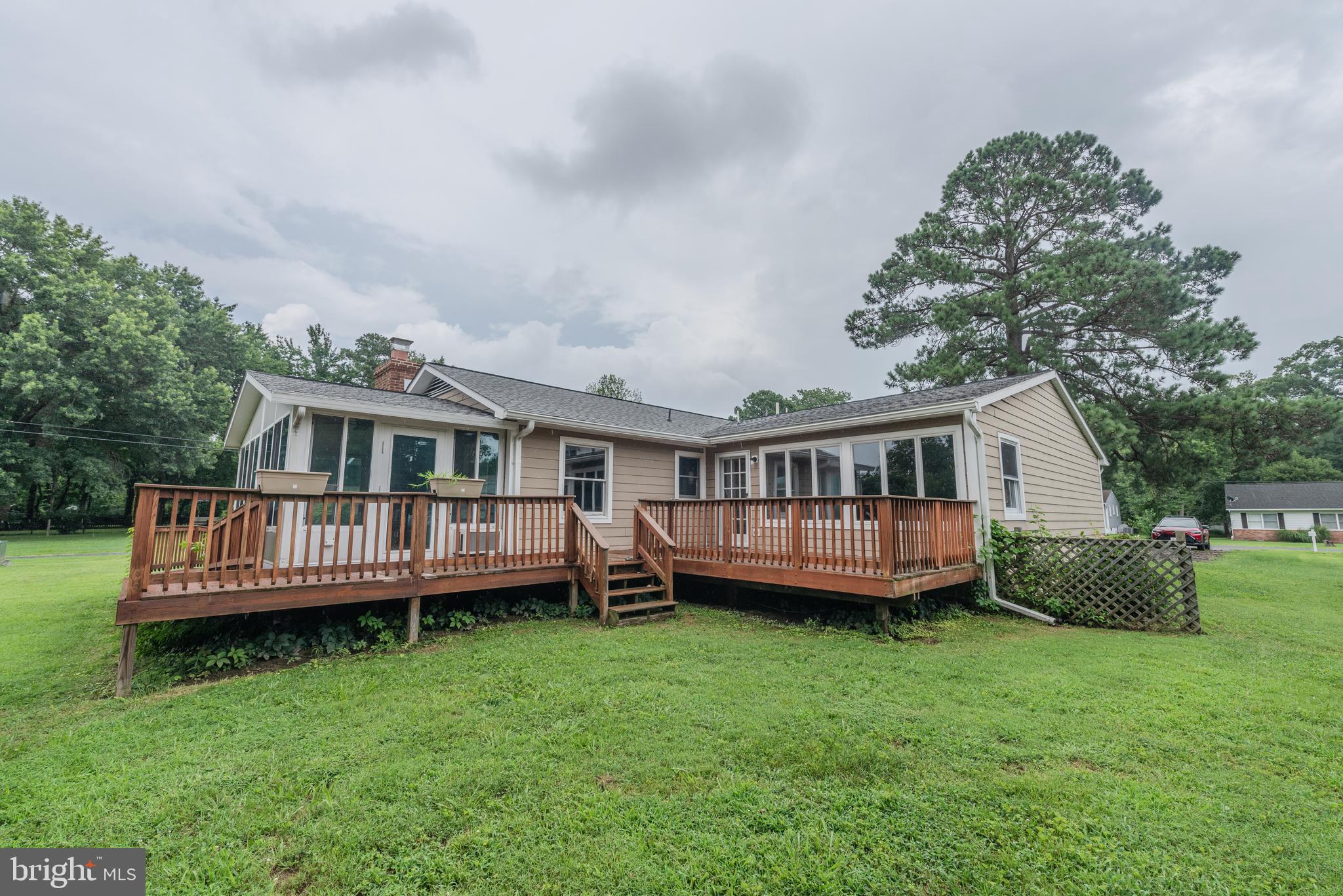 401 Kent Way Stevensville, MD 21666 - Photo 3 of 22 a view of a house with a backyard and deck