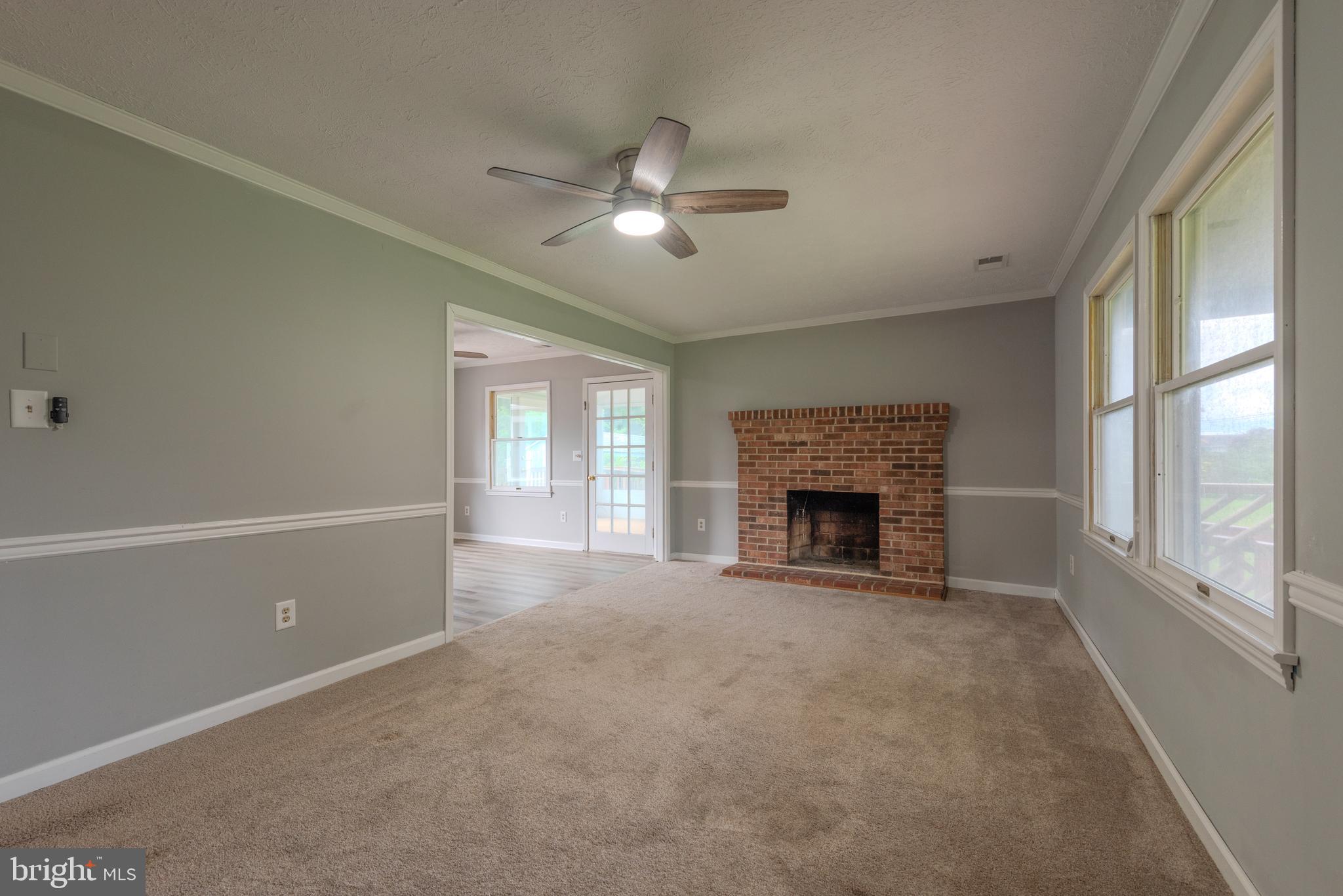 401 Kent Way Stevensville, MD 21666 - Photo 5 of 22 a view of a livingroom with a fireplace and window