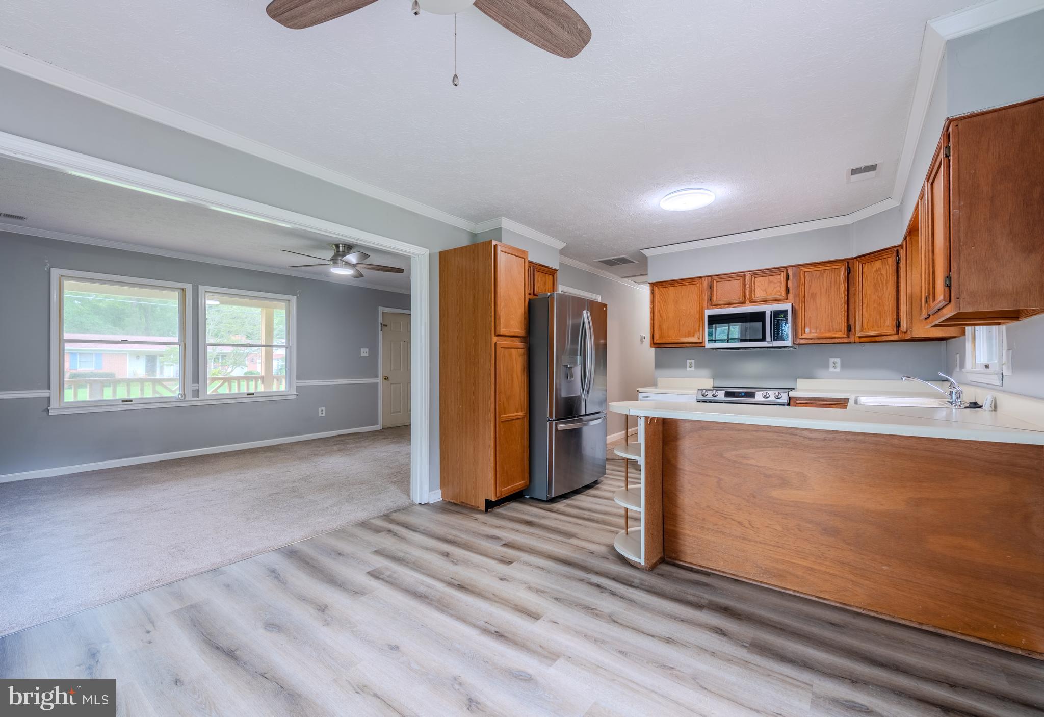 401 Kent Way Stevensville, MD 21666 - Photo 7 of 22 a view of kitchen with stainless steel appliances granite countertop a refrigerator and a sink