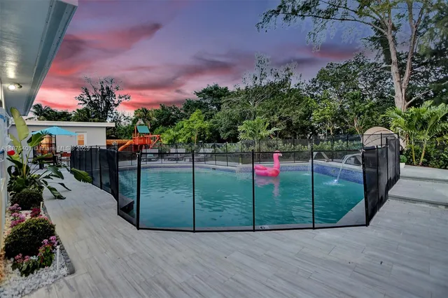 a bathroom with a sink and a washing machine with washing machine