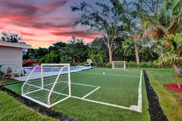 a view of a livingroom with furniture and a potted plant