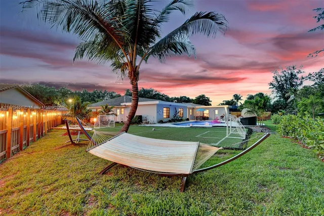 a bedroom with furniture and a flat screen tv