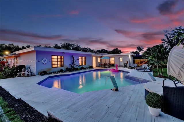 a bedroom with a bed and a night stand