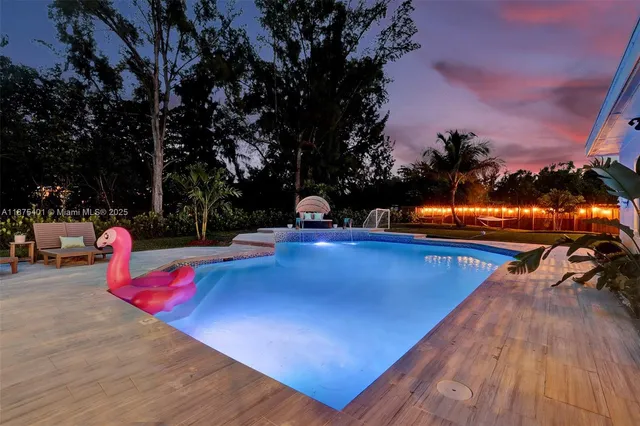a bathroom with a tub shower and sink
