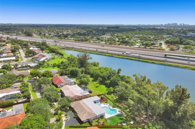 a bathroom with a toilet tub and shower
