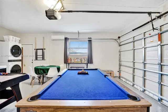 a bedroom with a bed and painting on the wall