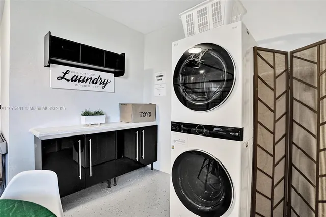 a bedroom with a bed and painting on the wall