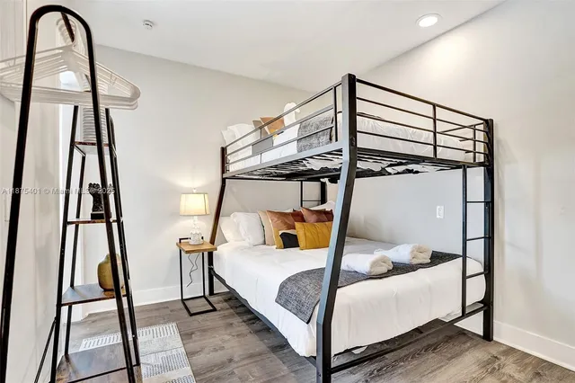 a living room with furniture a potted plant and a fireplace