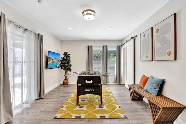 a view of a dining room with furniture and window