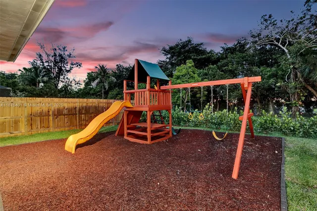 a view of a house with swimming pool and sitting area