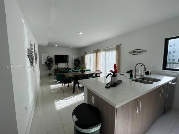 a bedroom with two beds and a window