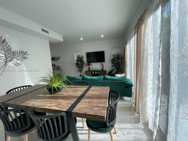 a bedroom with double bed and a window
