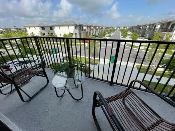 a view of a balcony with chair