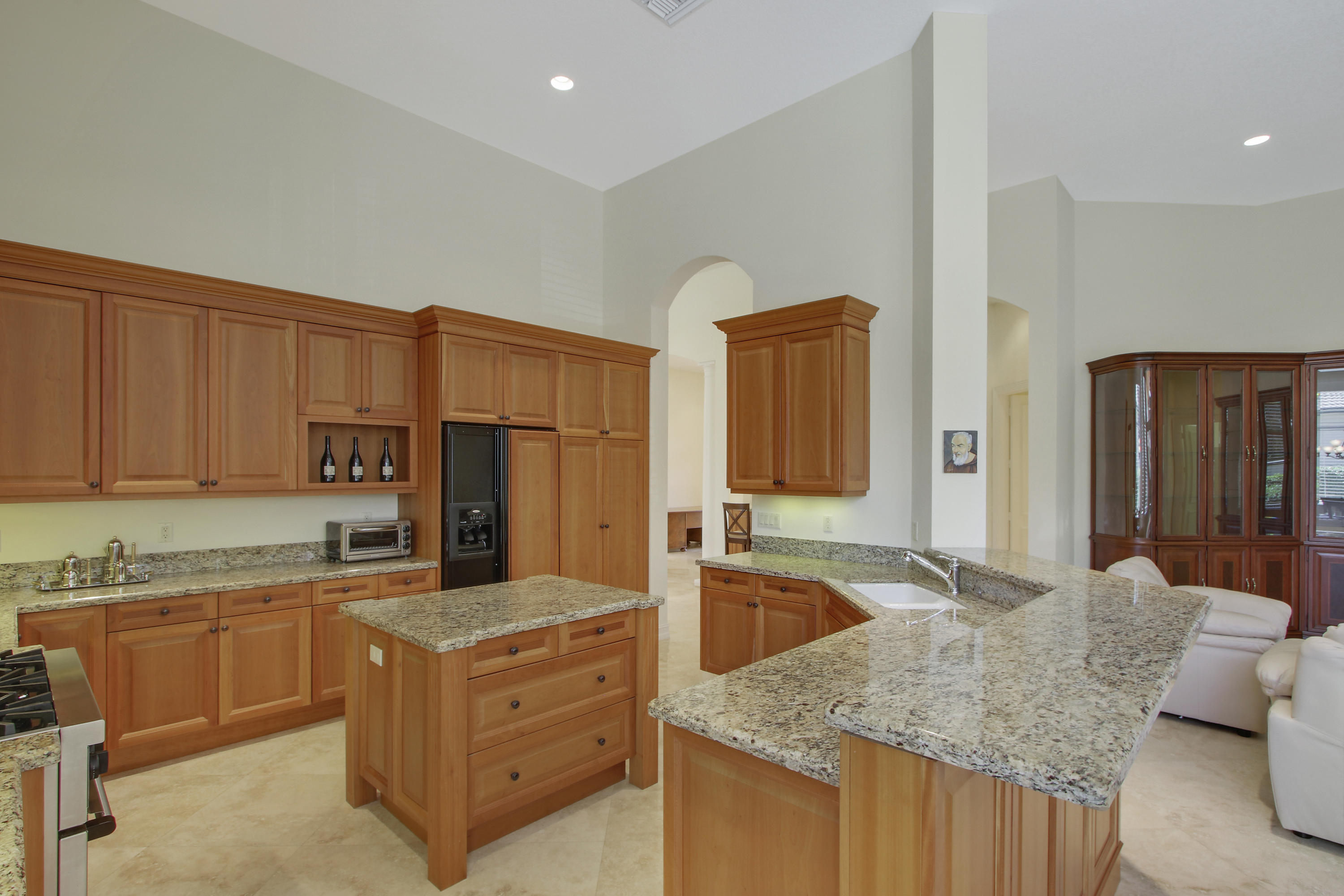 17897 Villa Club Way Boca Raton, FL 33496 - Photo 4 of 17 a kitchen with granite countertop a sink and cabinets