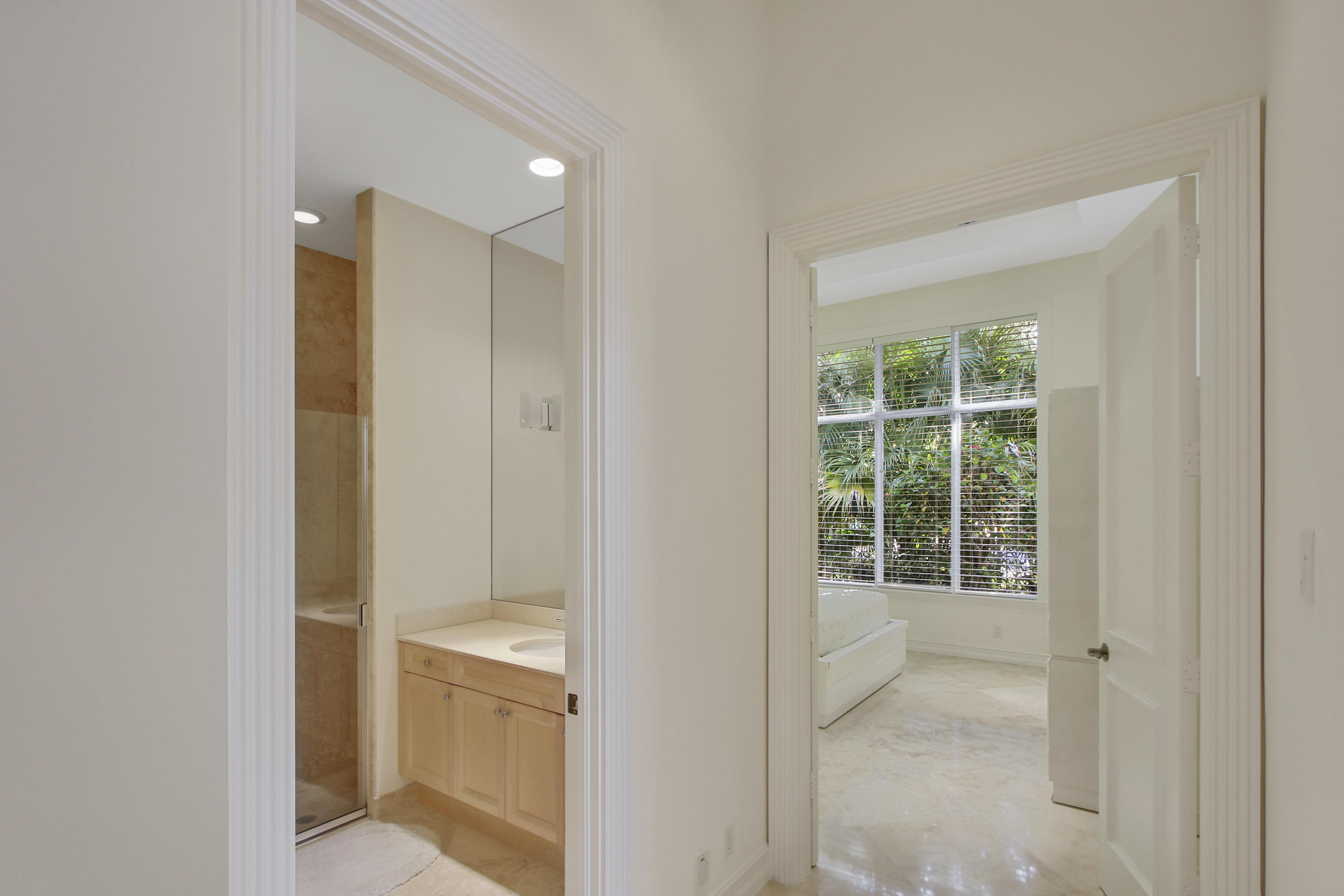 17897 Villa Club Way Boca Raton, FL 33496 - Photo 8 of 17 a bathroom with a glass door shower and a sink